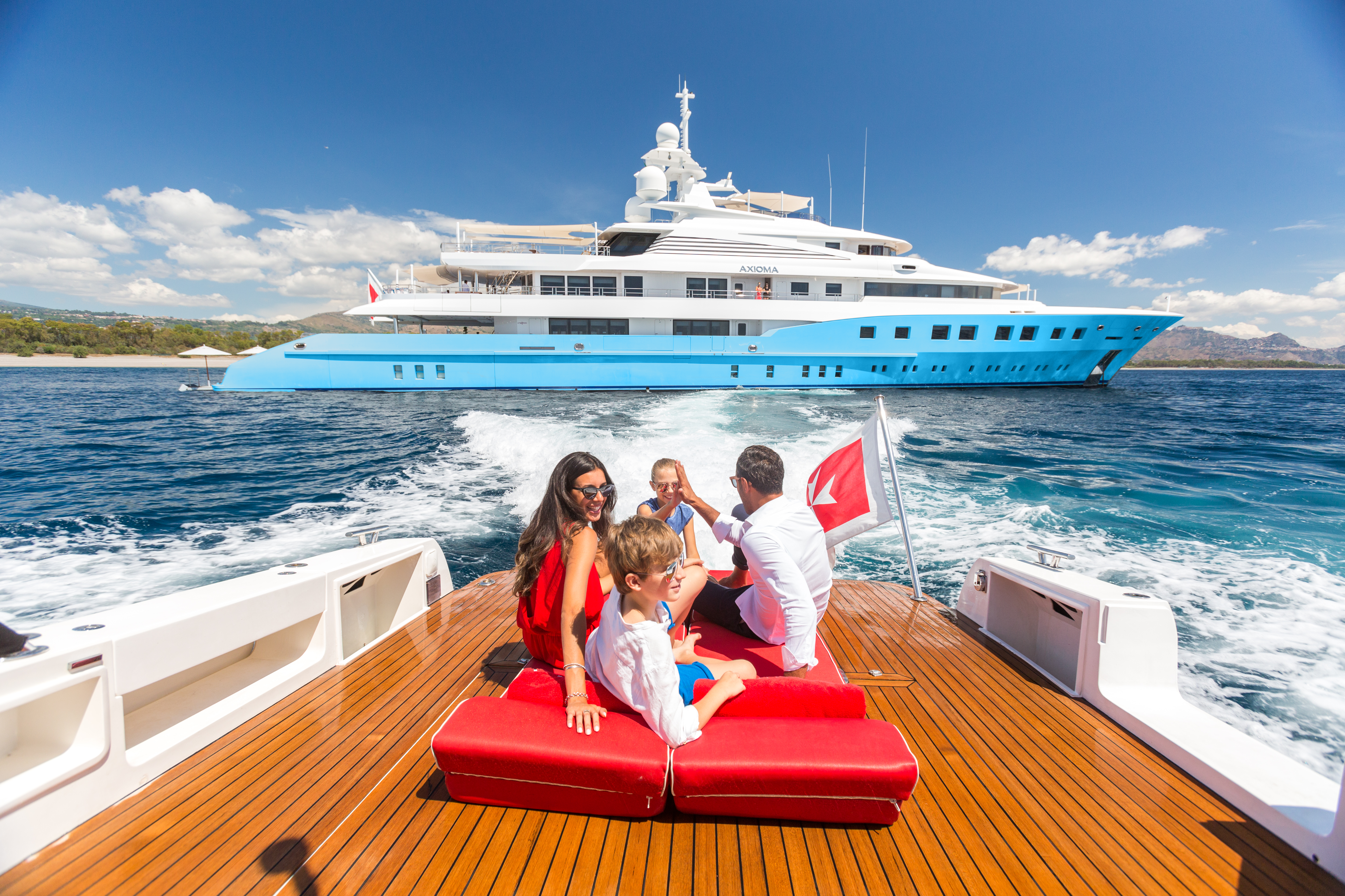 Axioma - family travel to a superyacht by tender